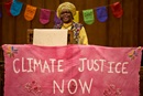 Musa Dube, the distinguished professor of New Testament at the Candler School of Theology in Atlanta, preaches during a Vigil for Creation on April 22 to mark Earth Day. The gathering took place at First United Methodist Church of Charlotte on the day before the United Methodist General Conference began its work nearby. Photo by Paul Jeffrey, UM News.