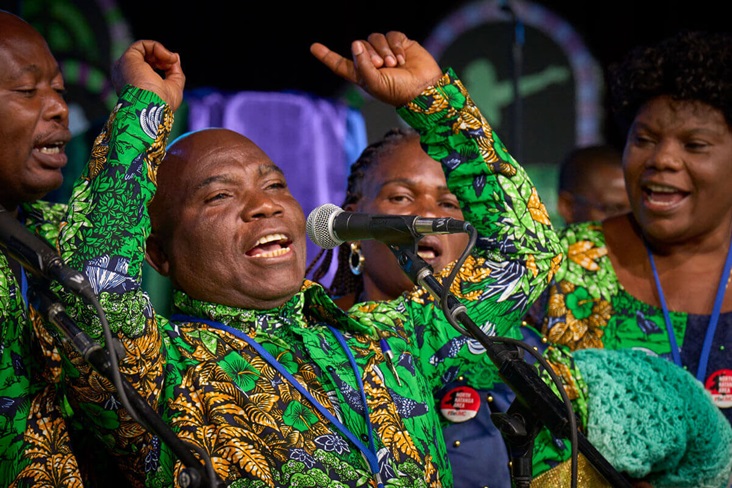 Congolese singers at General Conference The Rev. John Kabwit of the North Katanga Conference leads a choir of delegates from Congo in singing during morning worship on April 29 at the 2024 United Methodist General Conference in Charlotte, N.C. Photo by Paul Jeffrey/UM News.