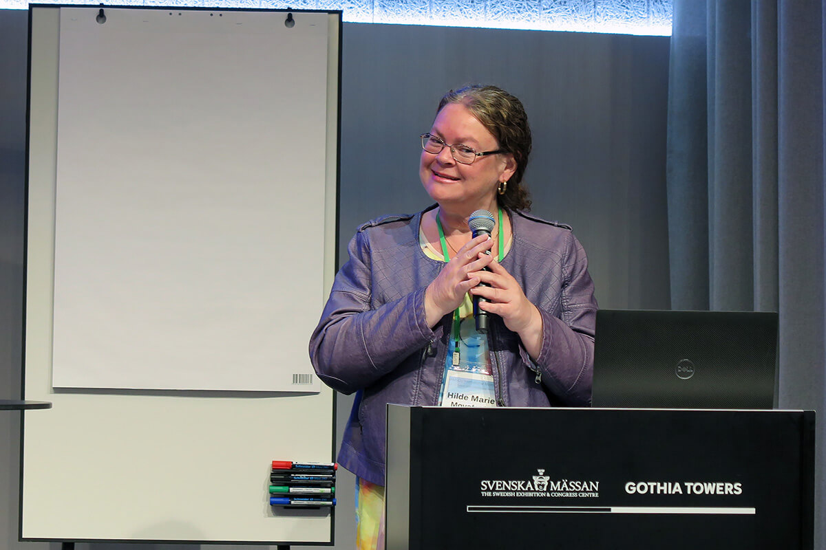 The Rev. Dr. Hilde Marie Movafagh, theologian and rector of The Theological Seminary of The United Methodist Church in Oslo, Norway, welcomes participants to the Aug. 11-13 gathering of the International Association of Methodist Schools, Colleges and Universities in Gothenburg, Sweden. Movafagh is also a board member of the association. The meeting, which took place immediately before the World Methodist Conference, drew about 100 scholars and university administrators from different Methodist denominations around the world. Photo by Heather Hahn, UM News.  