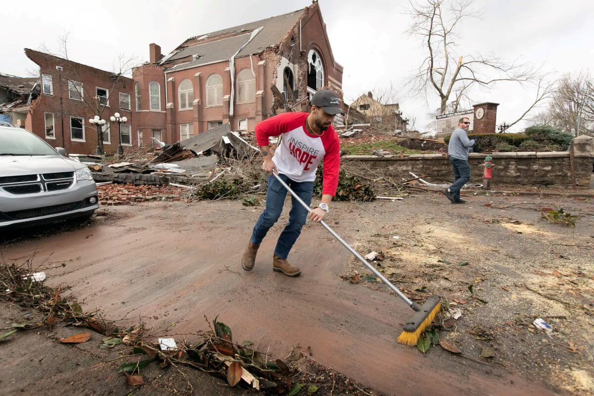 Volunteer Sumant Joshi clears tornado debris in front of East End United Methodist Church in Nashville, TN, in March 2020. (Photo: Mike DuBose, UM News)