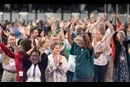 Delegates, visitors and staff of the United Methodist General Conference in Charlotte, N.C., dance in the aisles following morning worship on the final day of the conference. Photo by Mike DuBose, UM News.