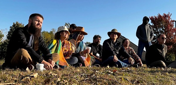 Tyle Vandeveer (first on left) listens intently with fellow EarthKeepers-in-training to a speaker at St. Peter's Catholic Church in St. Paul, Minn., community garden and prayer trail. (Photo: Courtesy of EarthKeepers)