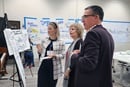 Sarah Metroff (left), marketing manager of investment for Wespath Benefits and Investments, speaks with M. Theresa Basile (middle), co-founder of United Methodists for Kairos Response, and Andy Hendren (right), top executive of Wespath, during September meetings at Garrett-Evangelical Theological Seminary in Evanston, Illinois. Wespath organized the summit to foster dialogue about its investments. Photo courtesy of Wespath Benefits and Investments.