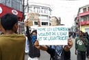 Young people march through the streets of Antananarivo, Madagascar, on Oct. 10 holding signs reading, “Even lemurs want water and electricity,” referring to the popular primates that are native to the country. The message highlights growing frustration among youth over the country’s persistent water and power shortages. Photo by Diary Andrian.