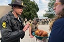 Illinois State Police Lt. Col. Jason Bradley (left) speaks with the Rev. Hannah Kardon, a United Methodist pastor who was among a group of clergy on Oct. 10 asking to bring Holy Communion to detainees in the U.S. Immigration and Customs Enforcement facility in Broadview, near Chicago. The following day another group of clergy also made the same request. Both times Bradley reached out to ICE officials, who denied the clergy entry. Photo by the Rev. Britt Cox, First United Methodist Church in Evanston, Ill.