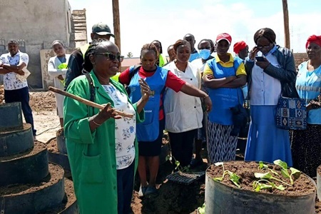 United Methodists in Naivasha host a community meeting that includes information on a community garden and HIV and AIDS prevention and treatment. Photo courtesy of Paul Matheri.