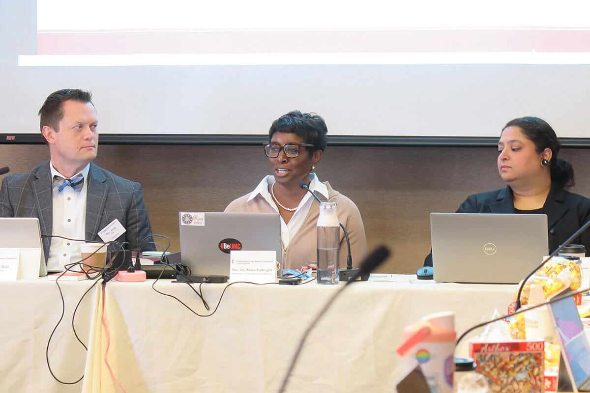 The Rev. Aleze M. Fulbright (center) celebrates the growth of The United Methodist Church in Africa as the Commission on the General Conference meets in Minneapolis on Nov. 11. Indiana Conference Bishop Tracy S. Malone announced Jan. 16 that Fulbright is leaving her role as General Conference secretary to become executive secretary to the bishop, starting in July. Photo by Heather Hahn, UM News.