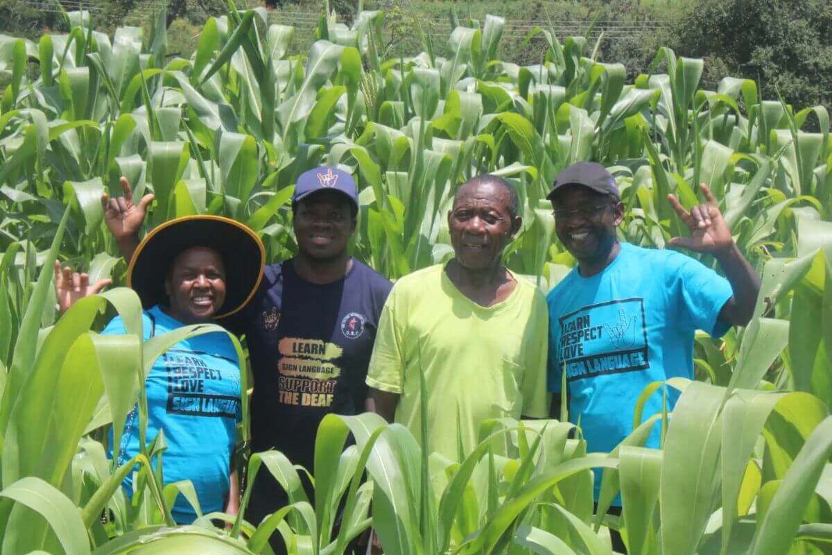 John Chokwadi Katema, second from right, donated a hectare of land for the Deaf Ministry Farming Project, operated by United Methodists in the Weirmouth area of Mutare, Zimbabwe. Standing with him, from left, are Spiwe Mhere, Pastor Collins Prempeh and Ishmael Katema. Photo by Kudzai Chingwe.