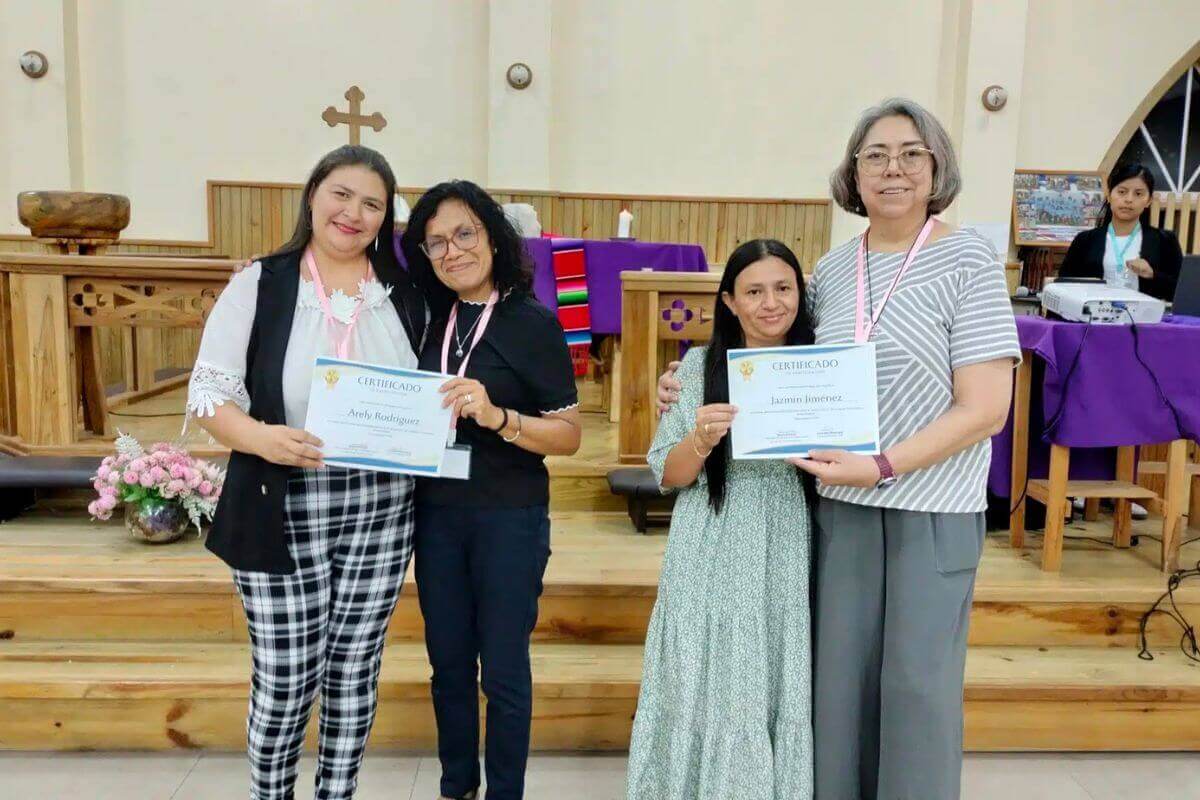 Arely Rodriguez receives her certificate from Karen Plaza (left) and Jasmin Jimenez receives hers from Global Missionary Maria de Lourdes Ramirez-Meneses Mroczka far right). Photo courtesy of Karen Plaza.