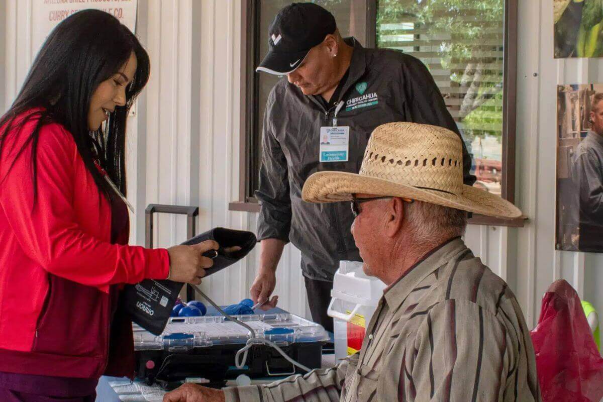 Chiricahua Health Center Workers provide health screenings for workers at Curry Farms. Photo courtesy of Chiricahua Health Centers.
