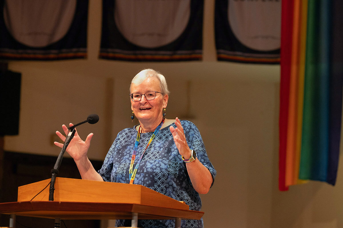 Jan Lawrence addresses Reconciling Ministries Network’s convocation held July 24-27, 2025, at First United Methodist Church in downtown Madison, Wis. Lawrence is retiring after serving as Reconciling Ministries Network’s executive director for nearly a decade. Many United Methodists credit her with helping to lead the denomination to a new day. File photo by Joscie Cutchens, UM News.