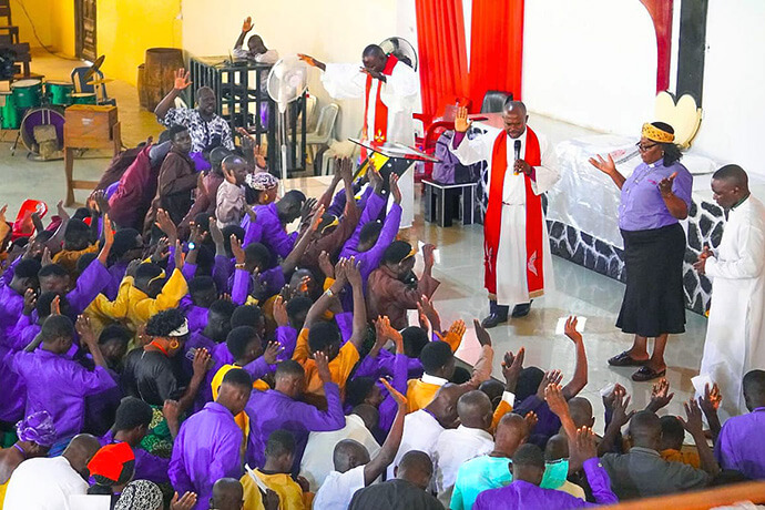 Bishop Ande I. Emmanuel (right center) prays for graduates of The United Methodist Church’s Technical Training Program during a July 1 ceremony in Jalingo, Nigeria, marking the program’s revival after a two-decade hiatus. Seventy-eight trainees graduated the vocational program with skills in electrical installation and welding fabrication. Photo by Joseph Dauda Idris, UM News. 