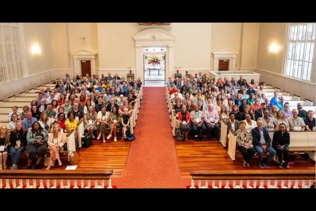 Participants at the Boards of Ordained Ministry Mid-Quadrennial Gathering assemble for a group photo after opening worship service on August 17 at the Peachtree Road United Methodist Church. Photo by Adam Bowers